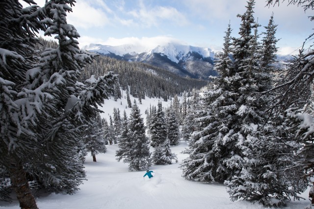 Skier Siena Teare celebrates the opening of Montezuma Bowl at Arapahoe Basin. Photo by Dave Camara courtesy of Arapahoe Basin.