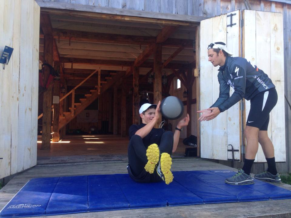 The newly appointed CXC Team Head Coach Andy Keller (r) functions on power with an athlete outdoors a barn near Cable, Wis. (Photograph: CXC/Facebook)