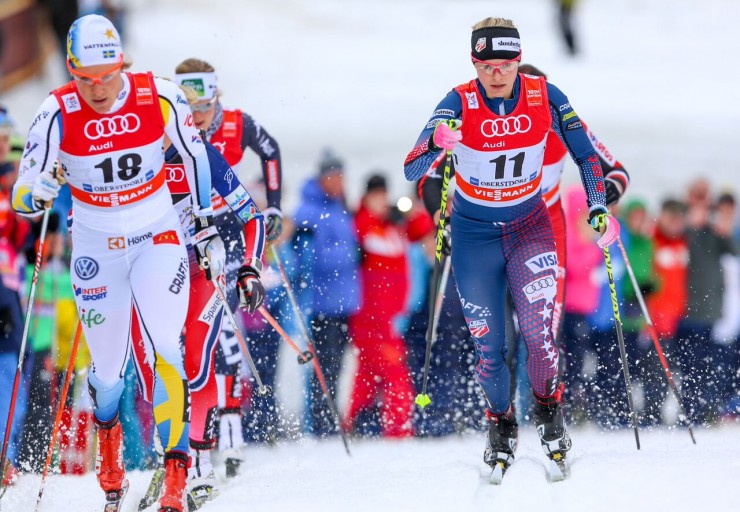 Jessie Diggins (11) throughout her quarterfinal of the one.two k traditional sprint at Stage 4 of the Tour de Ski in Oberstdorf, Germany. The American placed fifth following crashing with Hanna Falk (18). (Photo: Marcel Hilger)