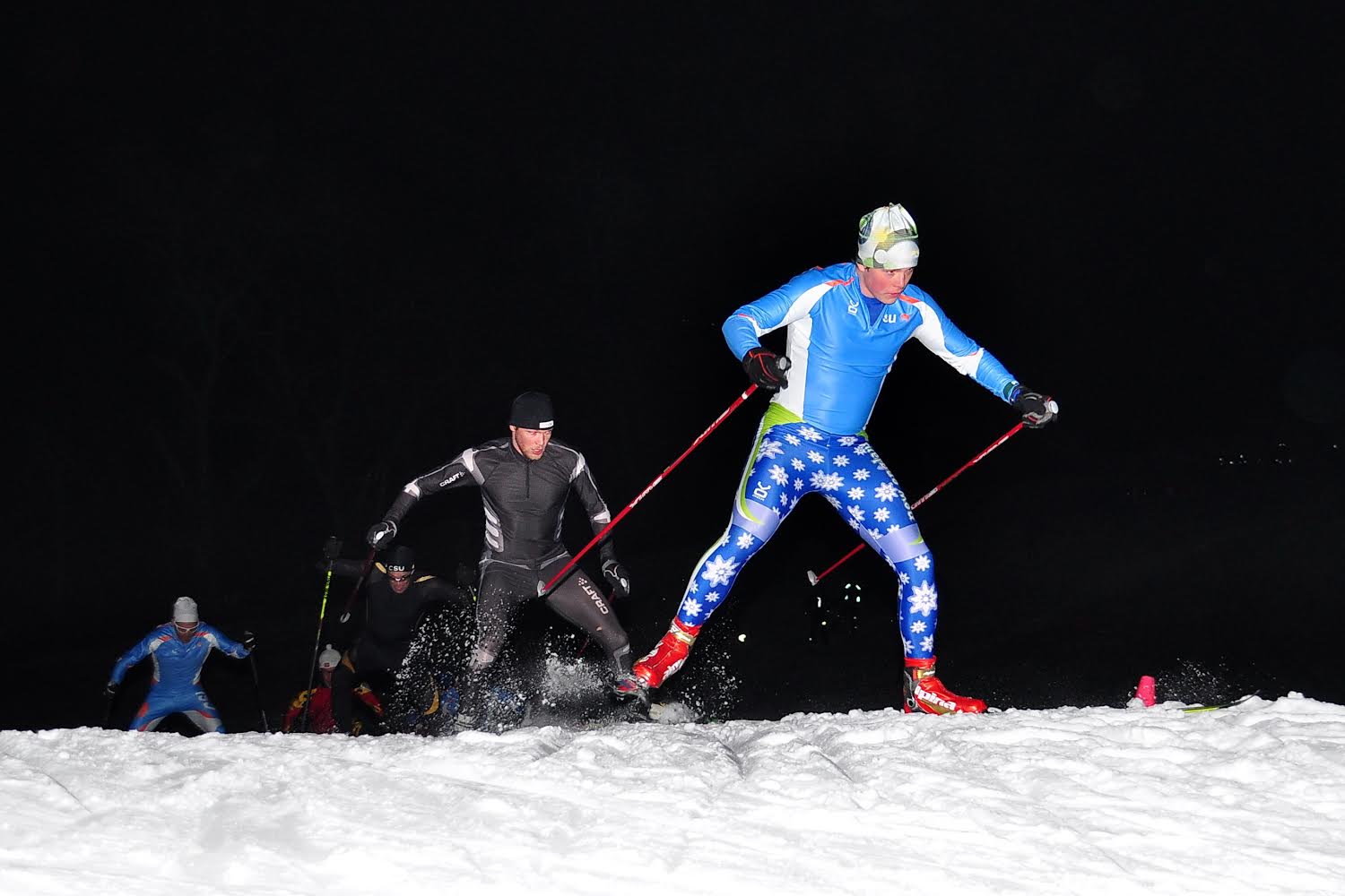 Hamish McEwen and Ian Situation train on the illuminated Weston Ski Track in Weston, Mass. (Photograph: Jamie Doucett)