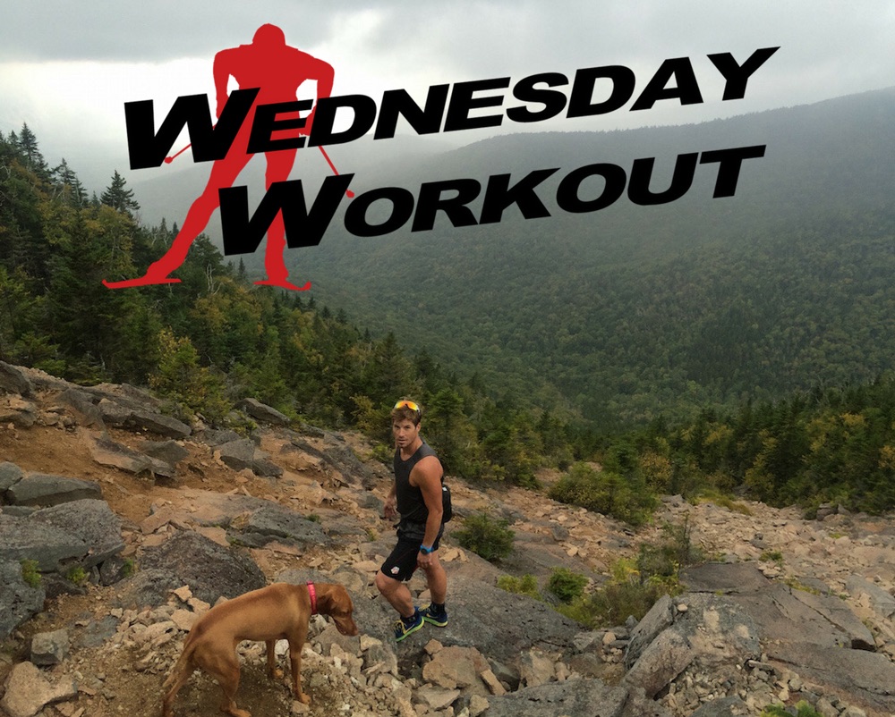 Kris Freeman and his dog She-Ra (along with Tad Elliott -- not shown) racing the rain up to the top of North Slide on Mt. Tripyramid in Waterville Valley, N.H., on Sept. 14. (Photo: Tad Elliott)