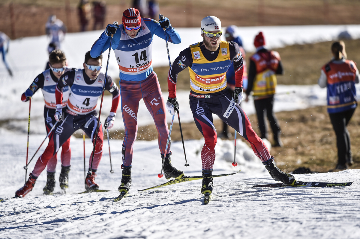 Alexander Legkov (bib 14) chasing Norway's Martin Johnsrud Sundby in the 15 k mass start skate in La Clusaz, France, on Saturday. (photo: Fischer/Nordic Focus)