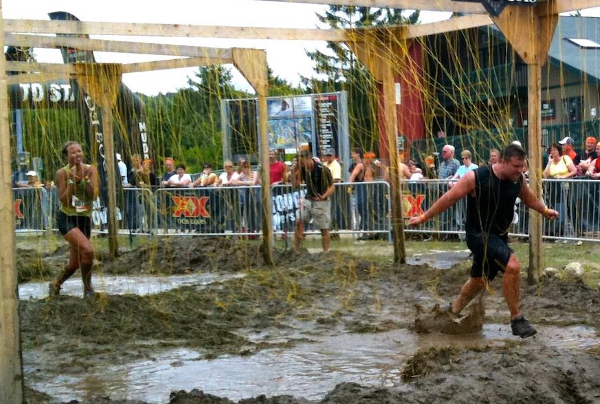 Something like this 2012 photo of FasterSkier editor Alex Kochon (l) and her brother running through a Tough Mudder "Electroshock Therapy" obstacle will work.