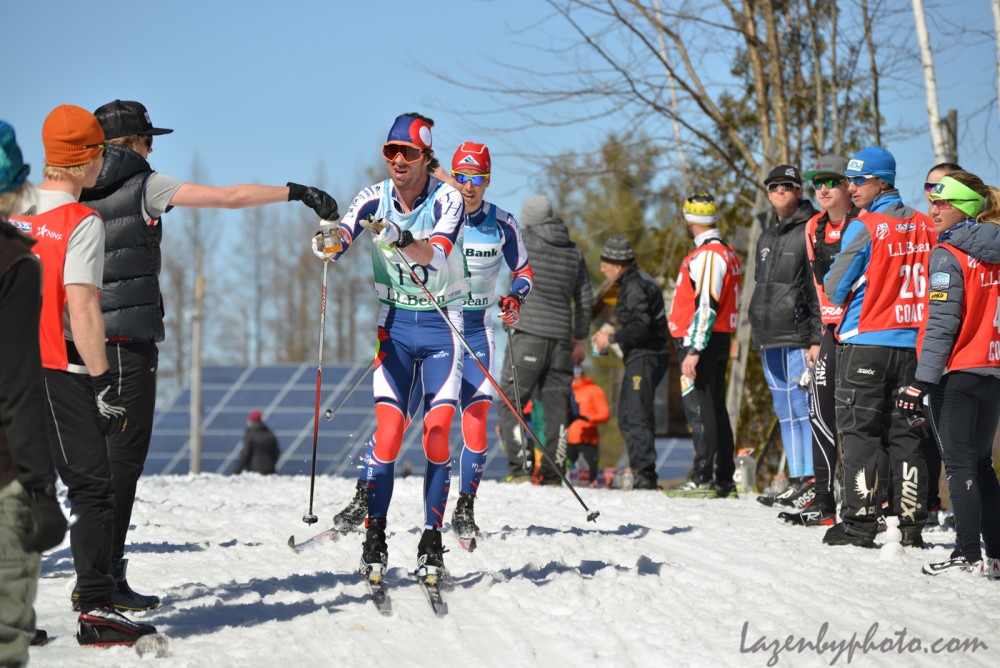 Tad Elliott of Ski and Snowboard Club Vail (l) receives a feed ahead of Noah Hoffman Ski and Snowboard Club Vail in the course of the men's 50 k at 2016 U.S. Distance Nationals on Saturday in Craftsbury, Vt. (Photograph: John Lazenby/Lazenbyphoto.com)