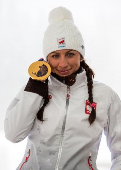 Justyna Kowalczyk with her gold from the 10 k classic at the 2014 Winter Olympics in Sochi, Russia. It was her second gold medal and fifth at the Olympics. Kowalczyk recently announced she plans to continue ski racing, but with modifications to her training. (Photo: FIS/NordicFocus)