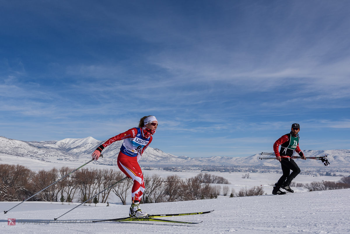 Canada's Lisle Compton (NTDC Thunder Bay) racing to 39th in Wednesday's 5 k freestyle, her first race of 2017 Junior World Championships at Soldier Hollow in Midway, Utah, while her coach cheers her on. (Photo: FlyingPointRoad.com)