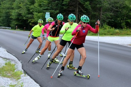 APU's Rosie Brennan prospects Stratton skiers for the duration of a above-distance, combi rollerski in Stratton, Vt.