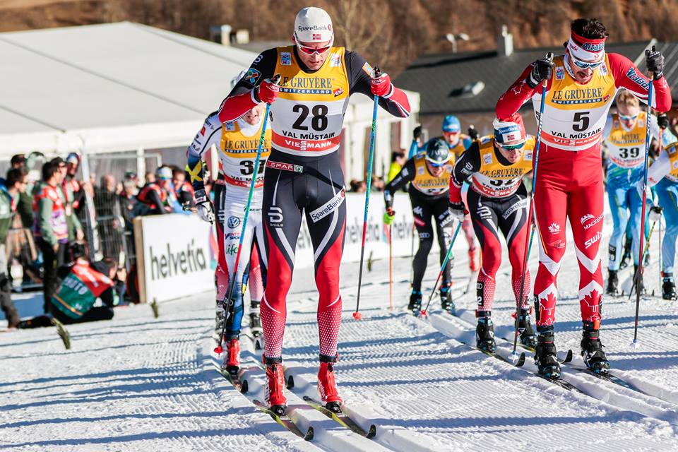 Norway's Niklas Dyrhaug (28) and Canada's Alex Harvey (r) racing toward the front of the pack in the men's 10 k classic mass start at Stage 2 of the Tour de Ski on Sunday in Val Mustair, Switzerland. Harvey went on to finish eighth while Dyrhaug placed 12th. (Photo: Fischer/NordicFocus)