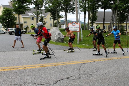 Andy Newell (l) and Alex Harvey (r) lead an over-distance rollerski past the Stratton Mountain College whilst Canadian coach Tor-Arne Hetland (l) checks in. 