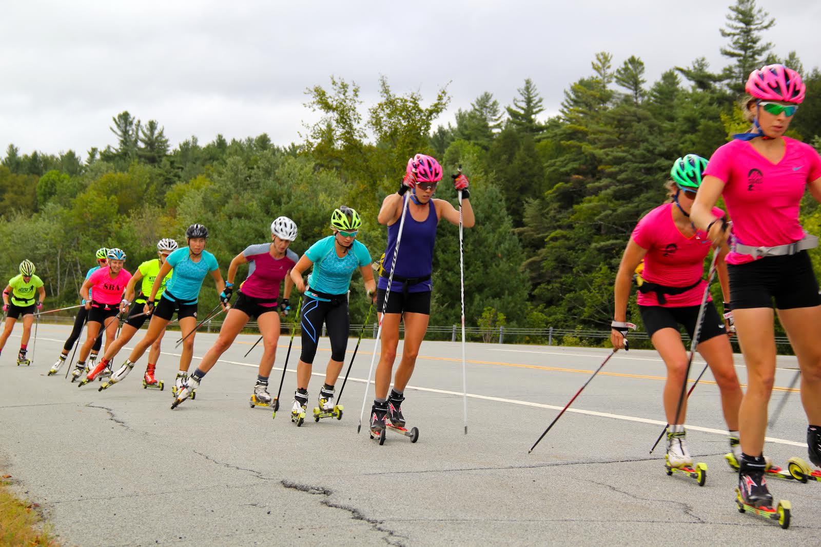 Annie Hart prospects Annie Pokorny, Mary Rose, Jessie Diggins, Deedra Irwin, Katharine Ogden, Kelsey Phinney, Hannah Halvorsen, Sophie Caldwell, and Hailey Swirbul in the course of a rollerski session close to Lake Placid, N.Y. (Photograph: Bryan Fish)