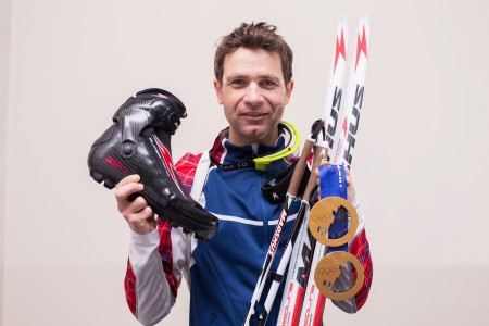 Ole Einar Bjørndalen with his two gold medals from Sochi and the gear that aided him get them. (Photograph: Madshus/NordicFocus)