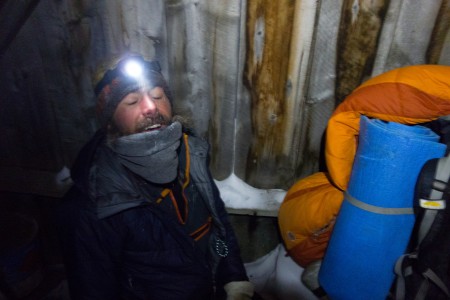 Miles Raney laughs in relief at having stumbled into a cabin during the wind storm in Skolai Creek. Photo: Seth Adams