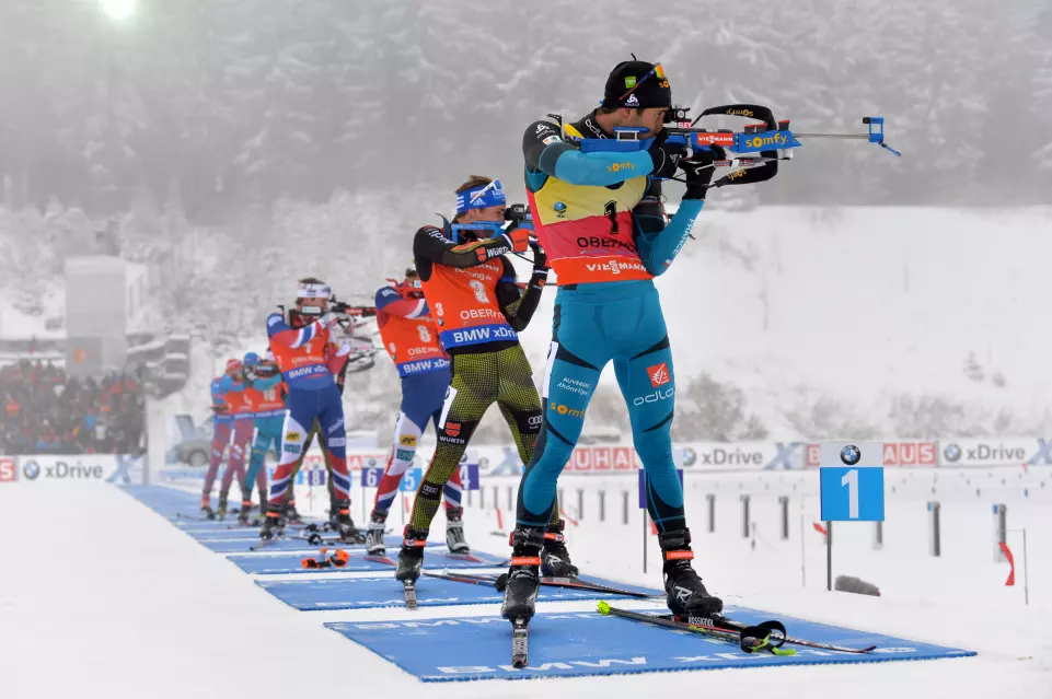 France’s Martin Fourcade (bib 1) and Germany’s Simon Schempp (bib 3) shooting in the third stage of the men’s 15-kilometer mass start at the 2017 IBU World Cup in Oberhof, Germany. (Photo: IBU)